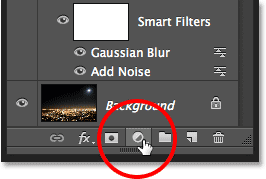 Clicking the New Adjustment Layer icon in the Layers panel. Image © 2013 Photoshop Essentials.com