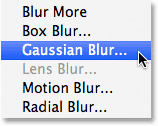 Selec<em></em>ting the Gaussian Blur filter from the Filter menu. Image © 2013 Photoshop Essentials.com