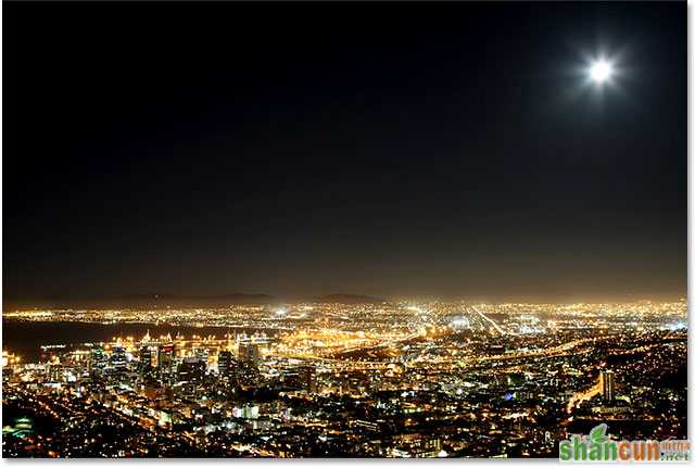 Cape Town harbor and city at night with moon in the sky. Image 59821666 licensed from Shutterstock by Photoshop Essentials.com